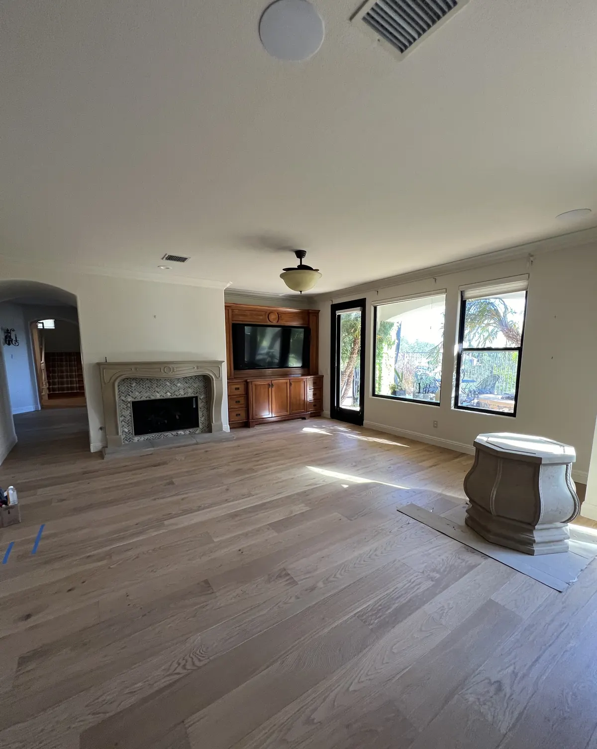 Family room with new wide-plank hardwood flooring