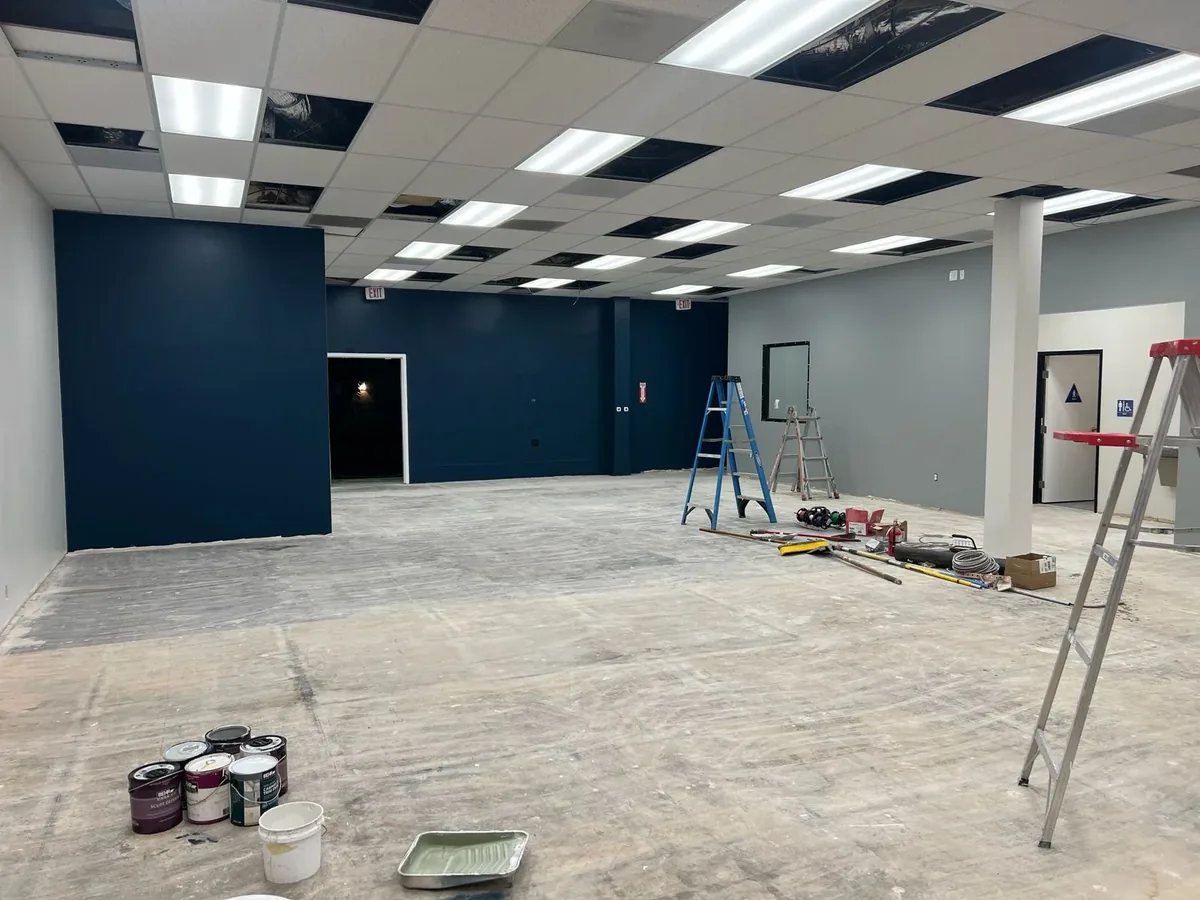 Large commercial interior under renovation in San Diego, framing and services in progress before fit-out