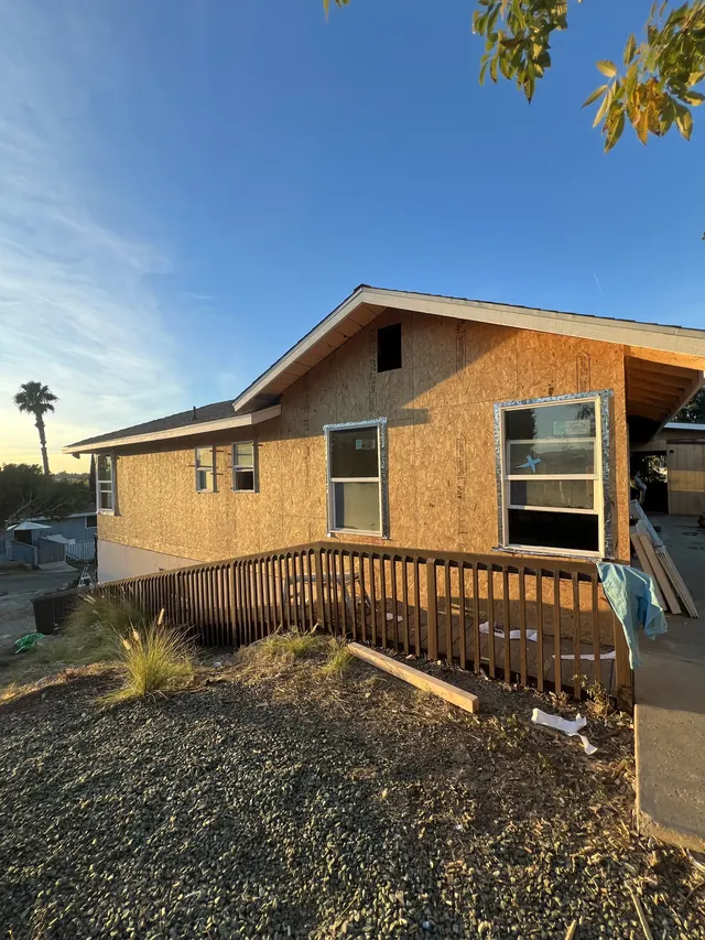 House exterior re-sheathed with new OSB panels during a whole-house remodel
